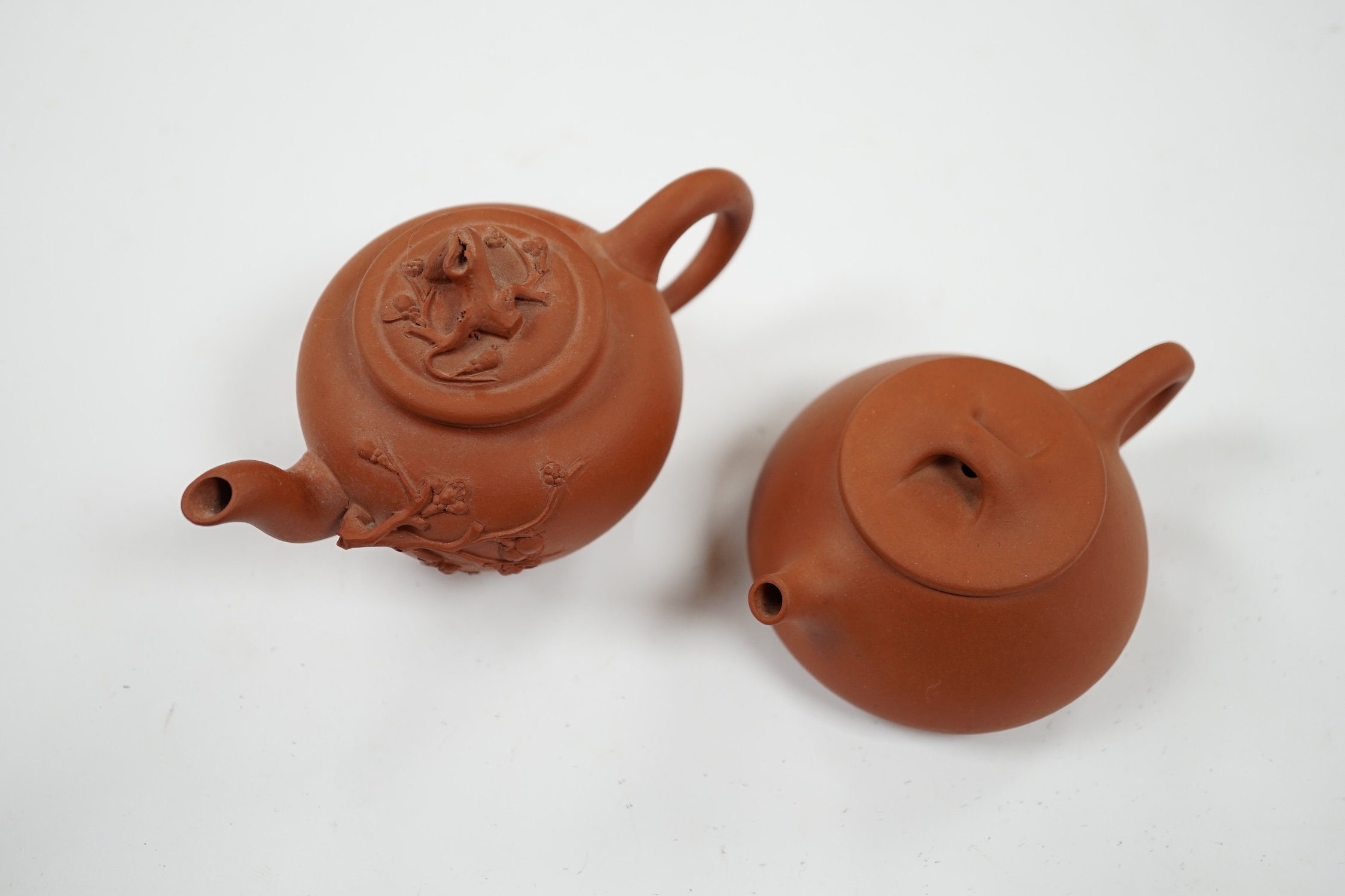 Two Chinese Yixing small teapots, largest 11.5cm wide. Condition - good